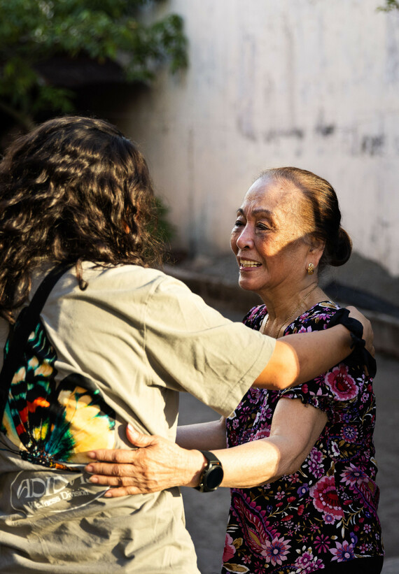 Two women hug each other